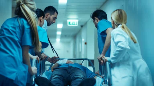 medical team wheeling a gurney